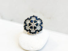 Load image into Gallery viewer, A sapphire and diamond flower cluster ring displayed against a white background
