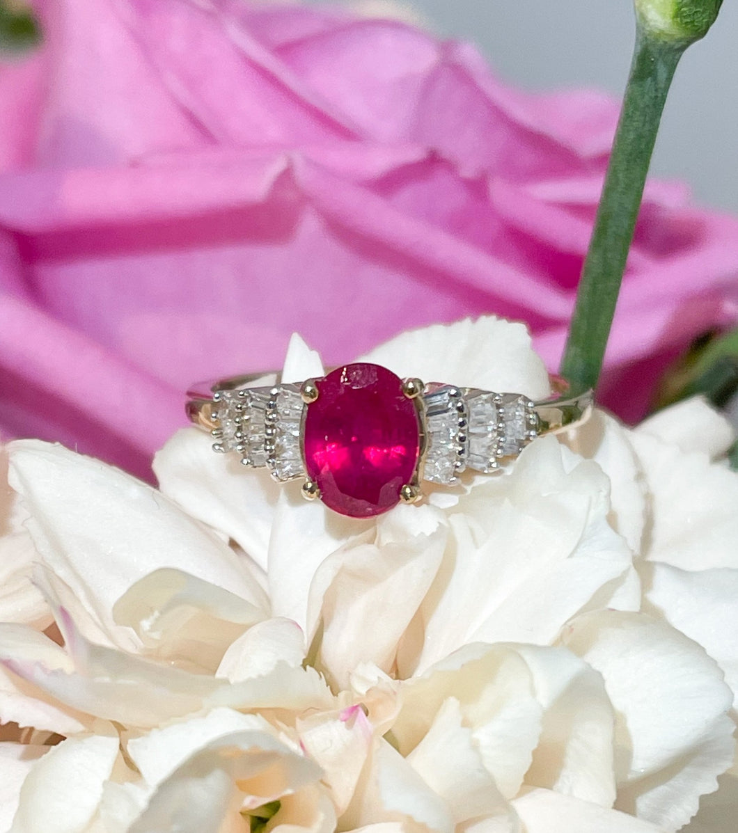 A large central ruby ring with baguette diamonds