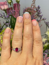 Load image into Gallery viewer, An Oval Ruby on Tiered Baguette Cut Diamond Shoulders
