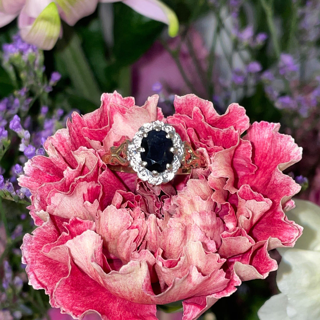 A Sapphire and Diamond Ring with Heart shoulders